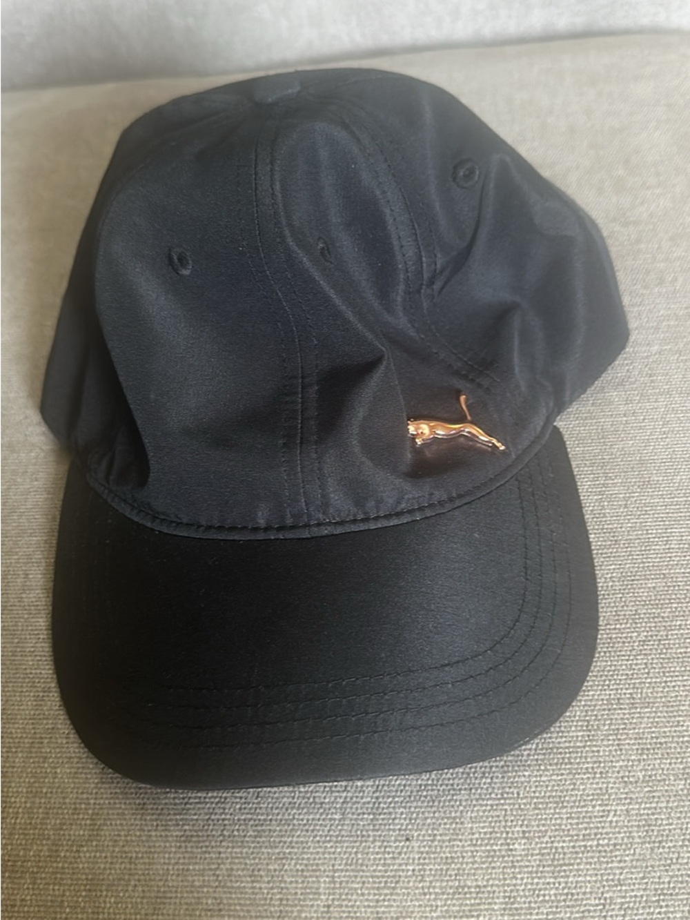 Puma Black Cap with Metallic Gold Puma Emblem